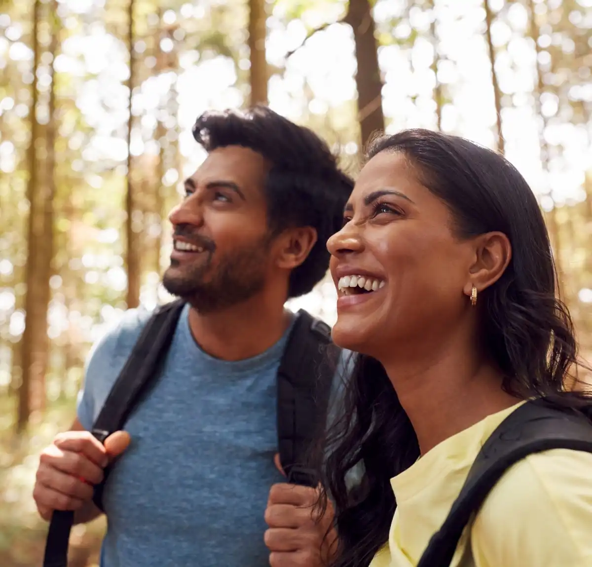 lasik-models-auroralasik-2 Millenial couple smiling on a hike